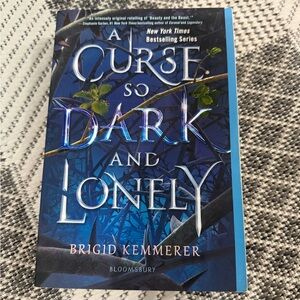 3/20$ A Curse So Dark and Lonely Book
